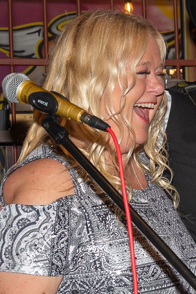 suzi dent at a show laughing